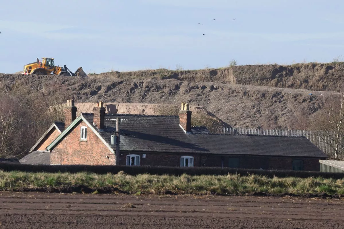 A large mound of material on Simonswood Industrial Estate near Kirkby in March 2025