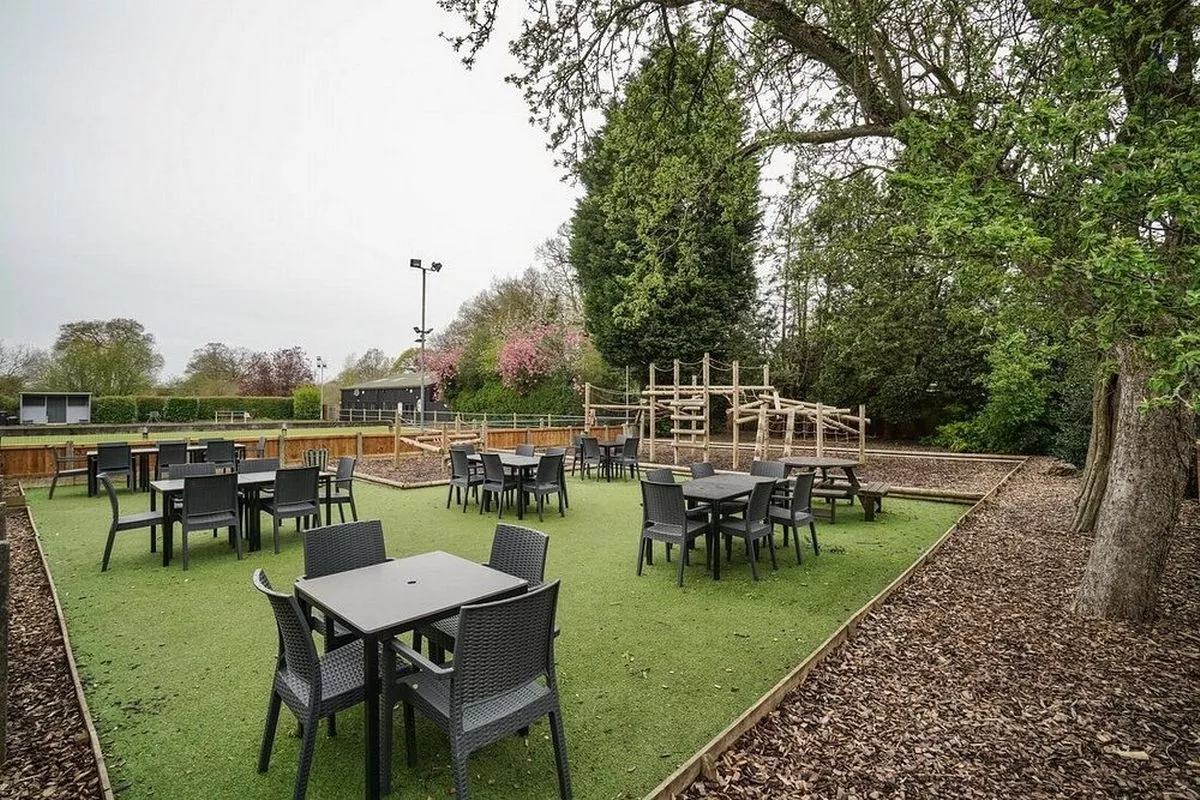 The pub building features an outdoor area, with a bowling green and a separate play centre
