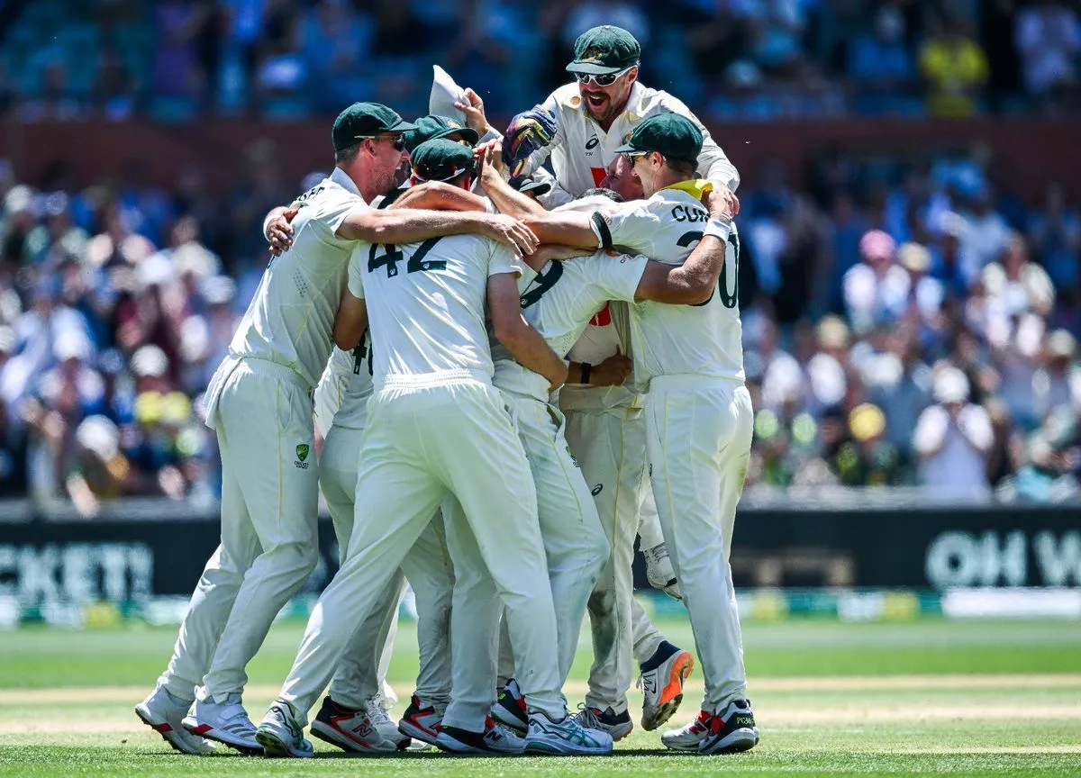 Australia players celebrate taking the final wicket against England in Adelaide