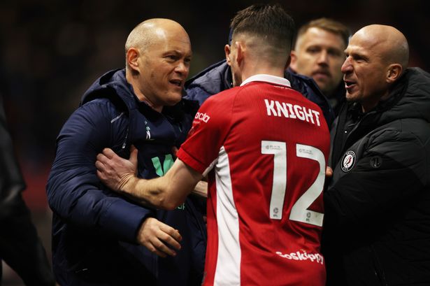 Bristol City captain Jason Knight pushes Millwall's manager Alex Neil.