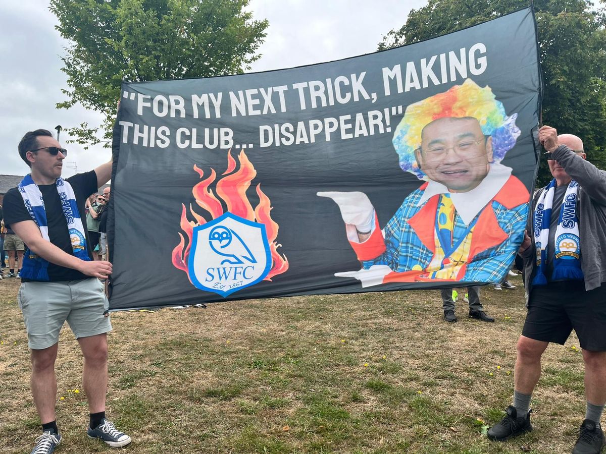 Sheffield Wednesday supporters held up comedic flags against Dejphon Chansiri