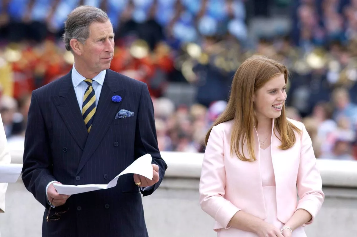 LONDON, UNITED KINGDOM - JUNE 04:  Prince Charles With Princess Beatrice Watching The Parade To Celebrate The Queen's Golden Jubilee From The Queen Victoria Memorial.  The Princess's Smile Reveals She Is Wearing Braces On Her Teeth.  (Photo by Tim Graham Photo Library via Getty Images)