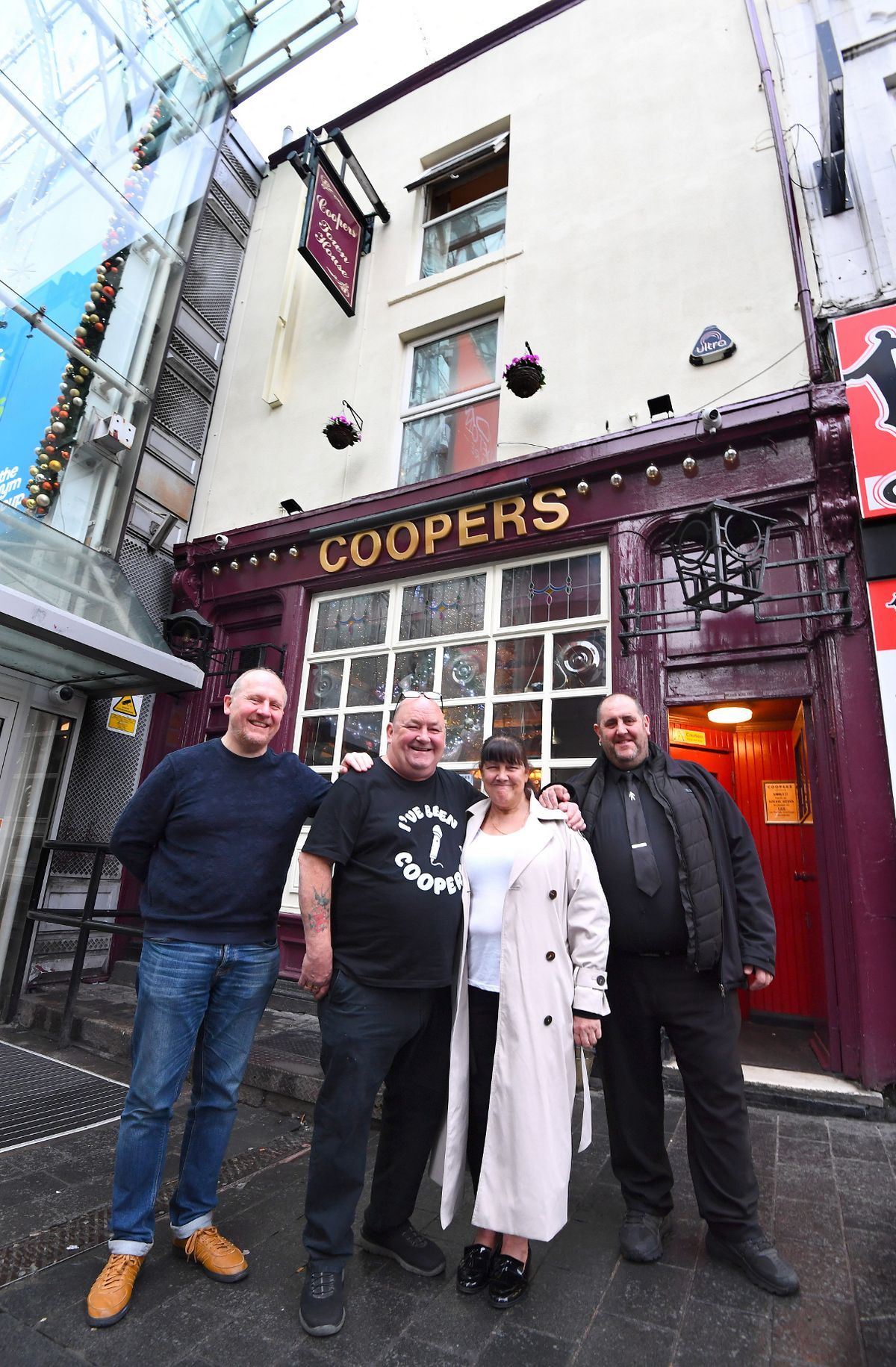 Coopers managers Steve Keegan and Maria Azzopardi (centre), proprietor Jonathan Yates (far left), and assistant manager Charlie Azzopardi