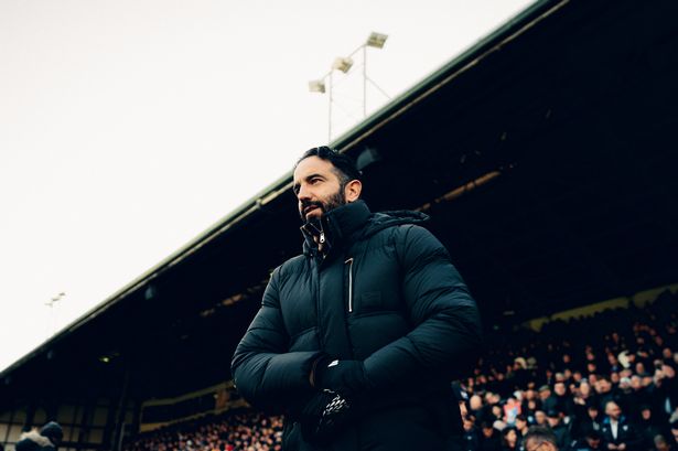 Amorim looks on from the dugout.
