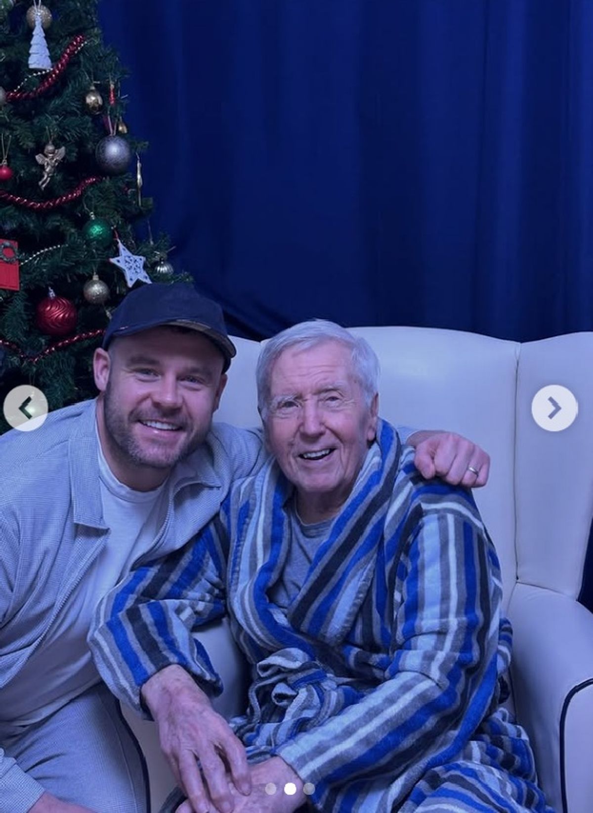 Danny Miller poses alongside his dad, Vince, at Christmas 