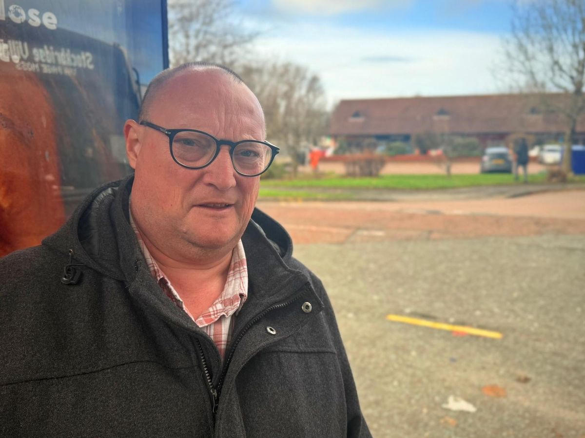 David Gerrard at bus stop in Stockbridge Village
