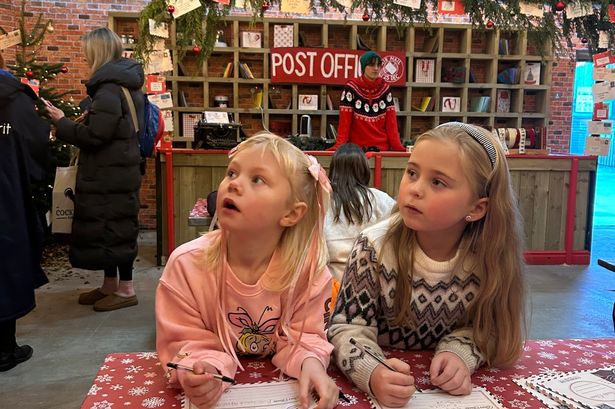 Bella and Evie writing their letters to Santa