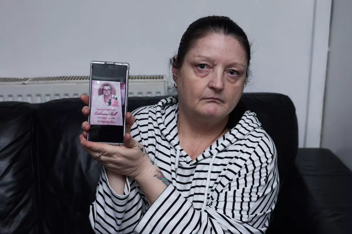 Eva Nolan showing a photograph on her phone of one of the missing pictures.