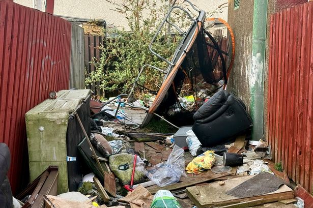 Piles of rubbish dumped in an alleyway in south Sefton