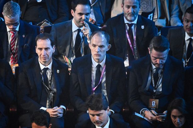 England's head coach Thomas Tuchel (C) reacts during the draw