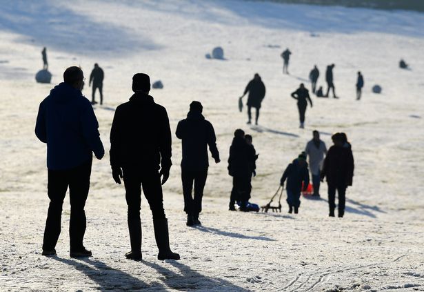 Families enjoying the snow at Camp Hill, Woolton