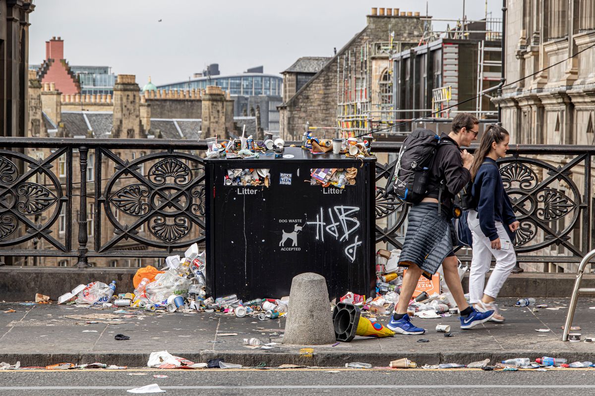 Mounting piles of waste in the Scottish capital as Edinburgh bin collection workers are on strike with the labor union asking for a minimum increase in the salary. Rubbish pile up outside the bins, while the overflowing bags and boxes spread rubbish on the street. On the litter bins many support stickers for the striking workers are seen. Rubbish including food waste has built up in the streets, while the city is having the Fringe Festival, one of the busiest times of year for the city with tourists across the world vising. Residents are being asked to keep their waste a little longer in the house. A major clean-up operation will start on Wednesday 31 August. According to Public Health Scotland, there will be public health impact from the bin strikes. Edinburgh, Scotland, United Kingdom on August 29, 2022 (Photo by Nicolas Economou/NurPhoto via Getty Images)
