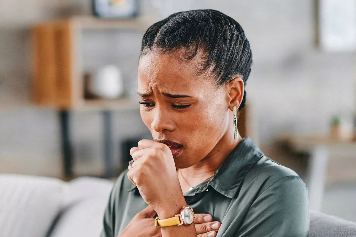 Woman coughing