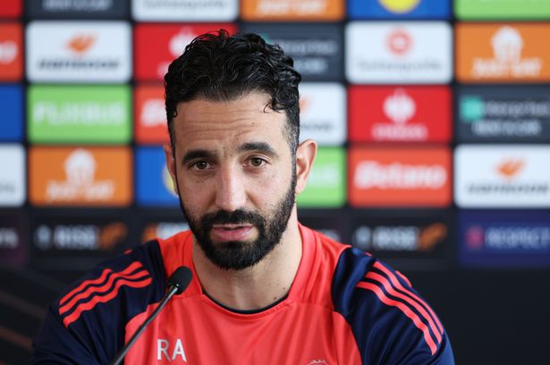 Ruben Amorim chats at a press conference. 