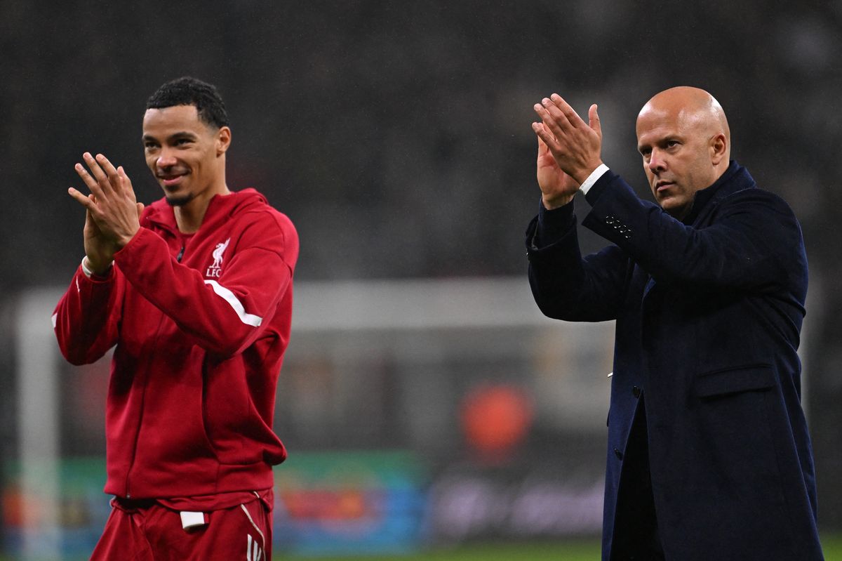 Liverpool's French striker #22 Hugo Ekitike and Liverpool's Dutch manager Arne Slot celebrate after the UEFA Champions League football match between Eintracht Frankfurt and Liverpool FC in Frankfurt, western Germany on October 22, 2025. (Photo by Kirill KUDRYAVTSEV / AFP) (Photo by KIRILL KUDRYAVTSEV/AFP via Getty Images)   