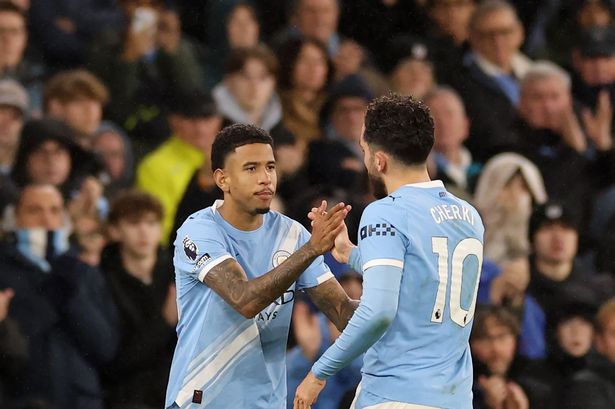 MANCHESTER, ENGLAND - DECEMBER 06: Rayan Cherki of Manchester City is replaced as a substitute by Savio during the Premier League match between Manchester City and Sunderland at Etihad Stadium on December 06, 2025 in Manchester, England. (Photo by Kate McShane/Getty Images)