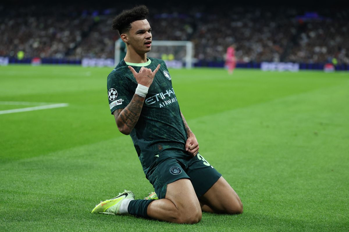 Manchester City's Nico O'Reilly celebrates scoring his team's first goal during the UEFA Champions League league phase day 6 football match between Real Madrid CF and Manchester City at Santiago Bernabeu 