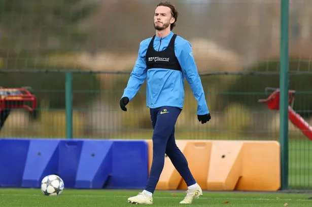 James Maddison was on the grass in the distance from a Tottenham training session at Hotspur Way on Monday