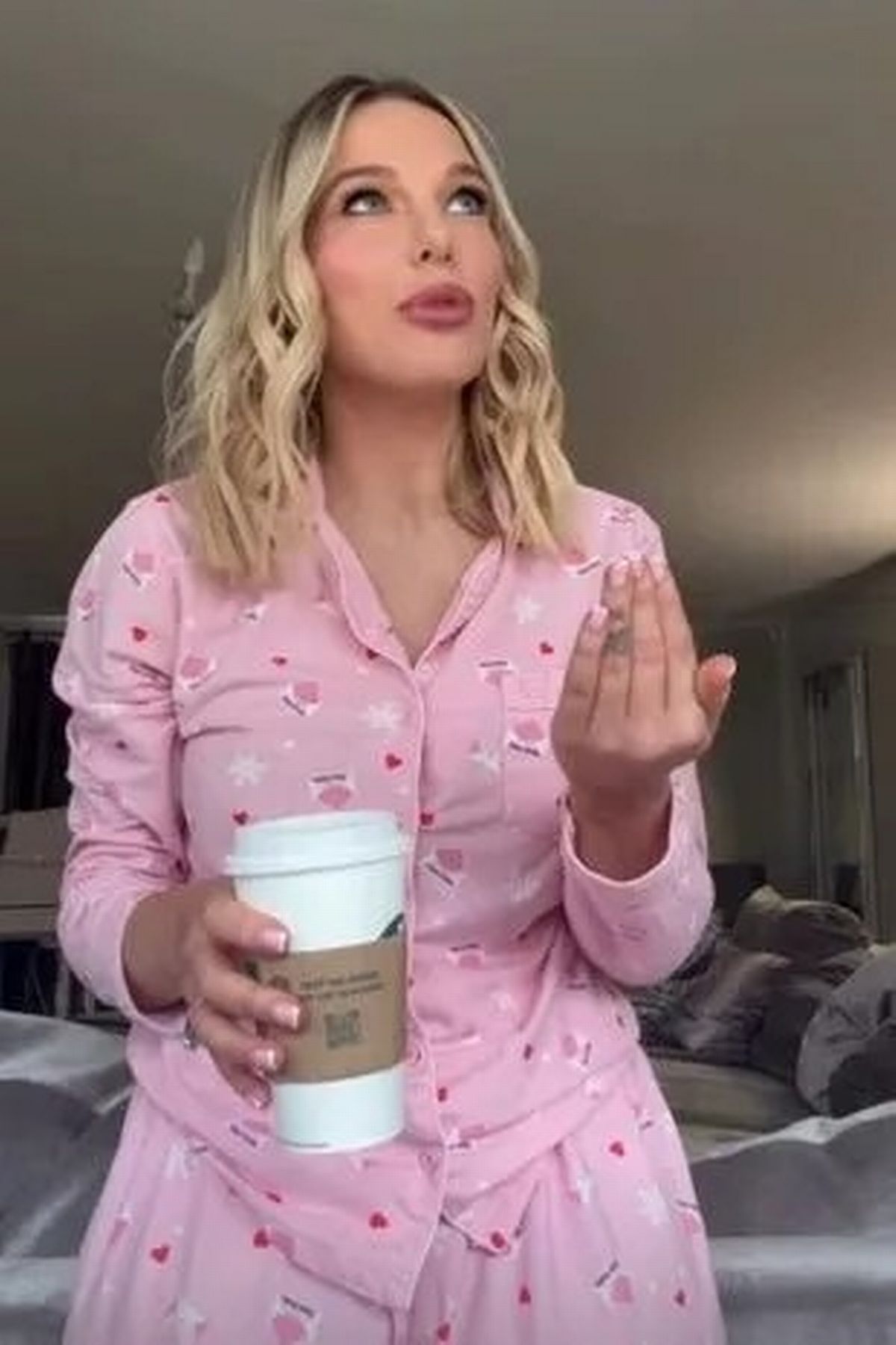 Helen Flanagan in pink pjs, holding a coffee cup.