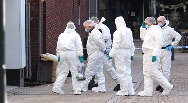Forensic officers carry out investigations in Altrincham