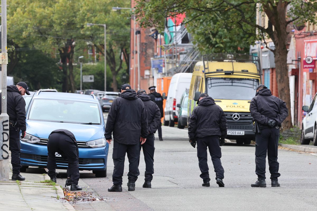Merseyside Police scene in Toxteth after a shooting as officers search nearby Granby Street.