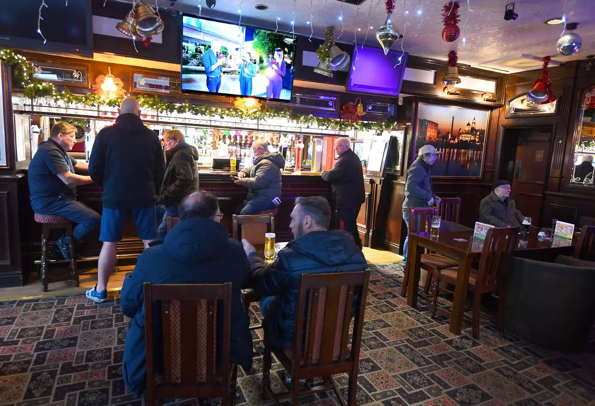Customers enjoying a drink in The Albion pub, Bootle