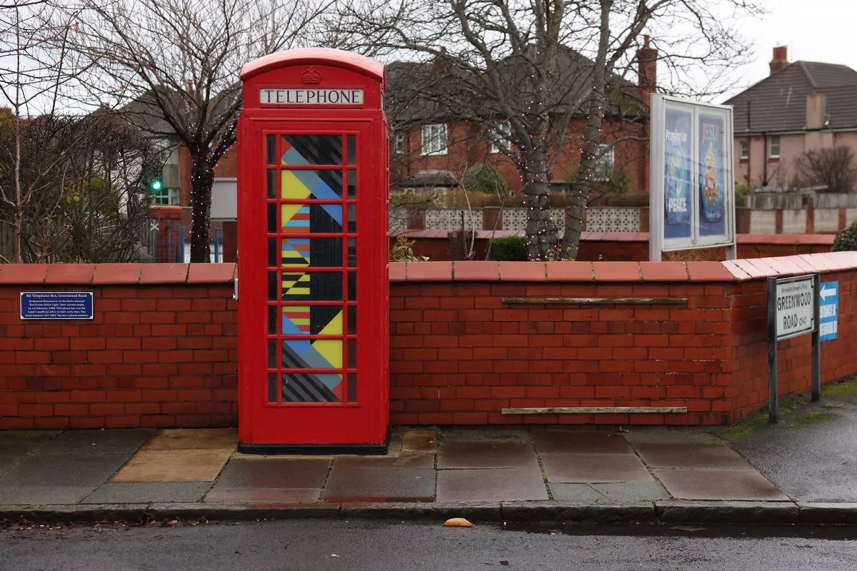 A red phone box in Meols, Wirral, used as an unofficial office by Orchestral Manoeuvres in the Dark