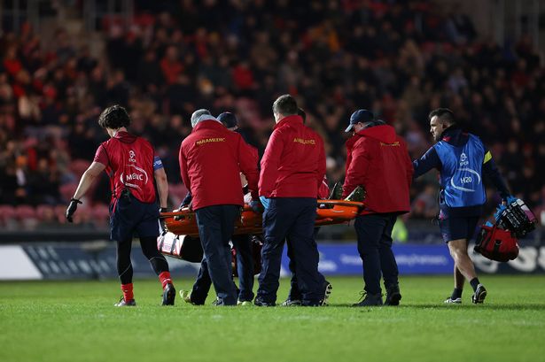 Archer Holz of Scarlets leaves the field on a stretcher