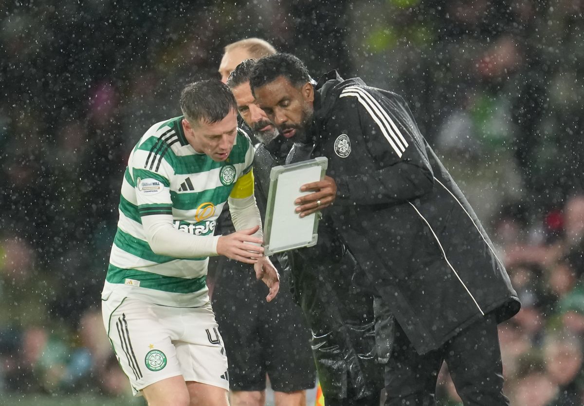 Derek McInnes looks on as Wilfried Nancy shows his tactics board to Callum McGregor