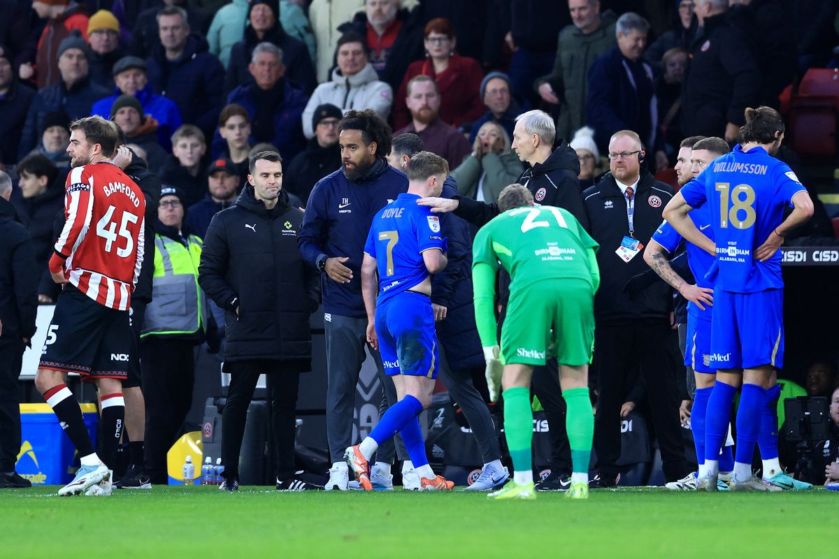 Tommy Doyle of Birmingham City leaves the pitch after being shown a red card