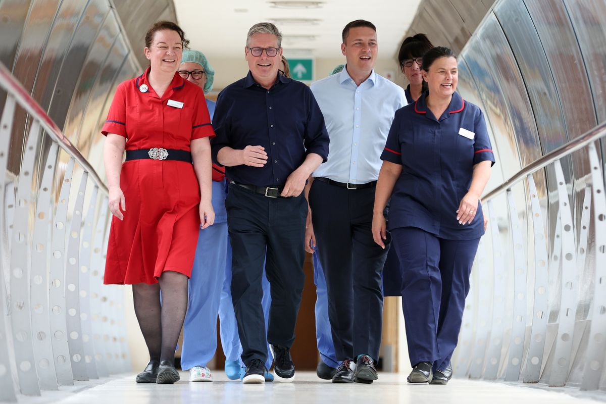 Keir Starmer (2nd L) and Shadow Secretary of State for Health Wes Streeting (3rd R) meet staff as they visit Bassetlaw Hospital Nottinghamshire