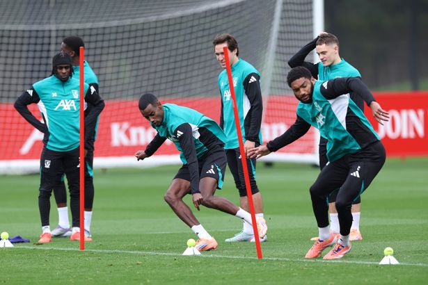 Alexander Isak and Joe Gomez of Liverpool FC practice during a training session at AXA Melwood Training Centre