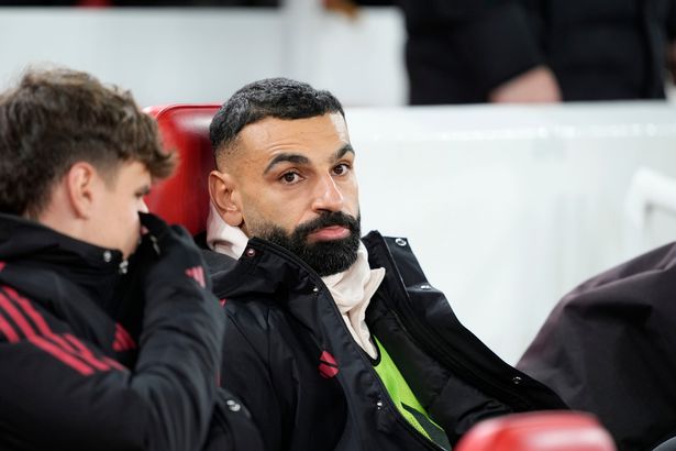 Mohamed Salah sat on the Liverpool bench