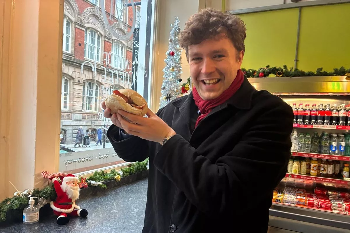 Echo reporter Jonathan Blackburn with a breakfast bin lid from Mangetout on Old Hall Street.