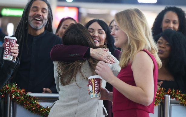 The actress was spotted reuniting families at Stansted Airport