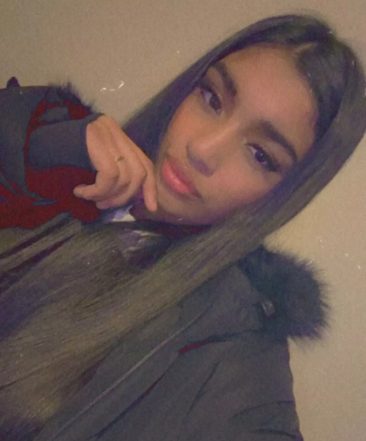 A family issued photo of Miriam who is black, with long brown hair and brown eyes and at the time of her disappearance she is believed to have been wearing a black puffer coat and black leggings    