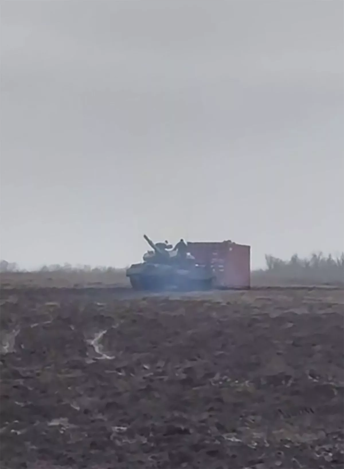 Footage shows a T-62 Russian tank dragging a sea container across a field for 'military purposes'
