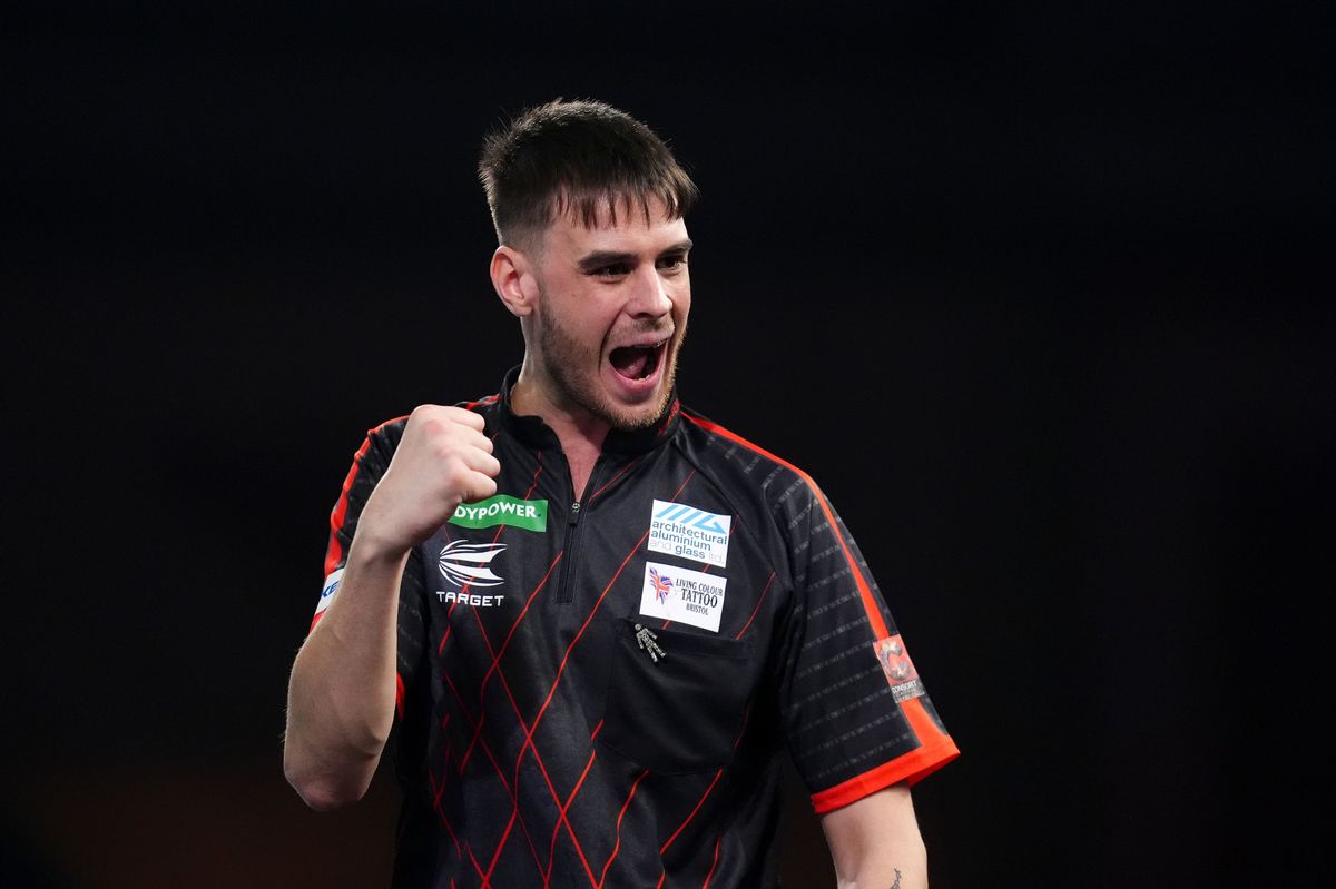 Dom Taylor reacts during his match against Oskar Lukasiak on day four of the Paddy Power World Darts Championship at the Alexandra Palace,