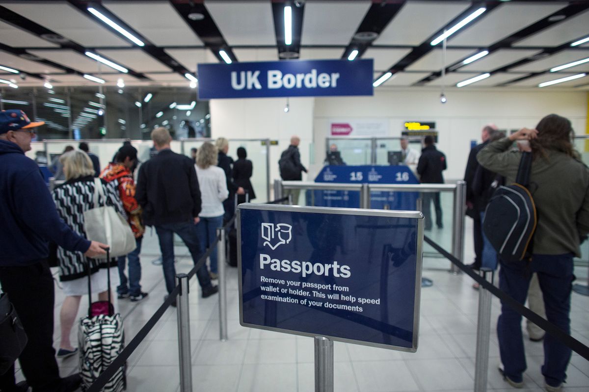 A border check queue at an airport