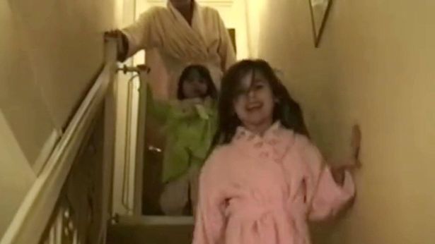 Jess and Rebecca very young walking down the stairs