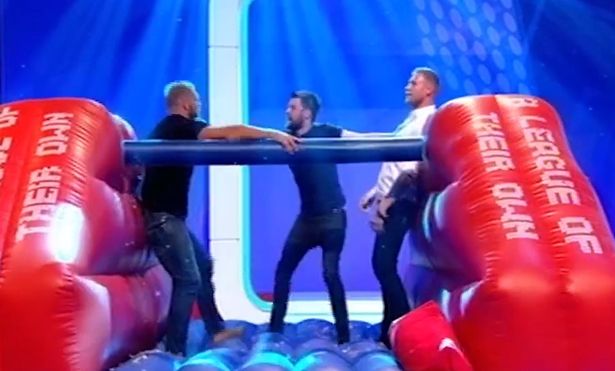 Whitehall breaks up a staged fight between Haskell and Flintoff on A League of Their Own