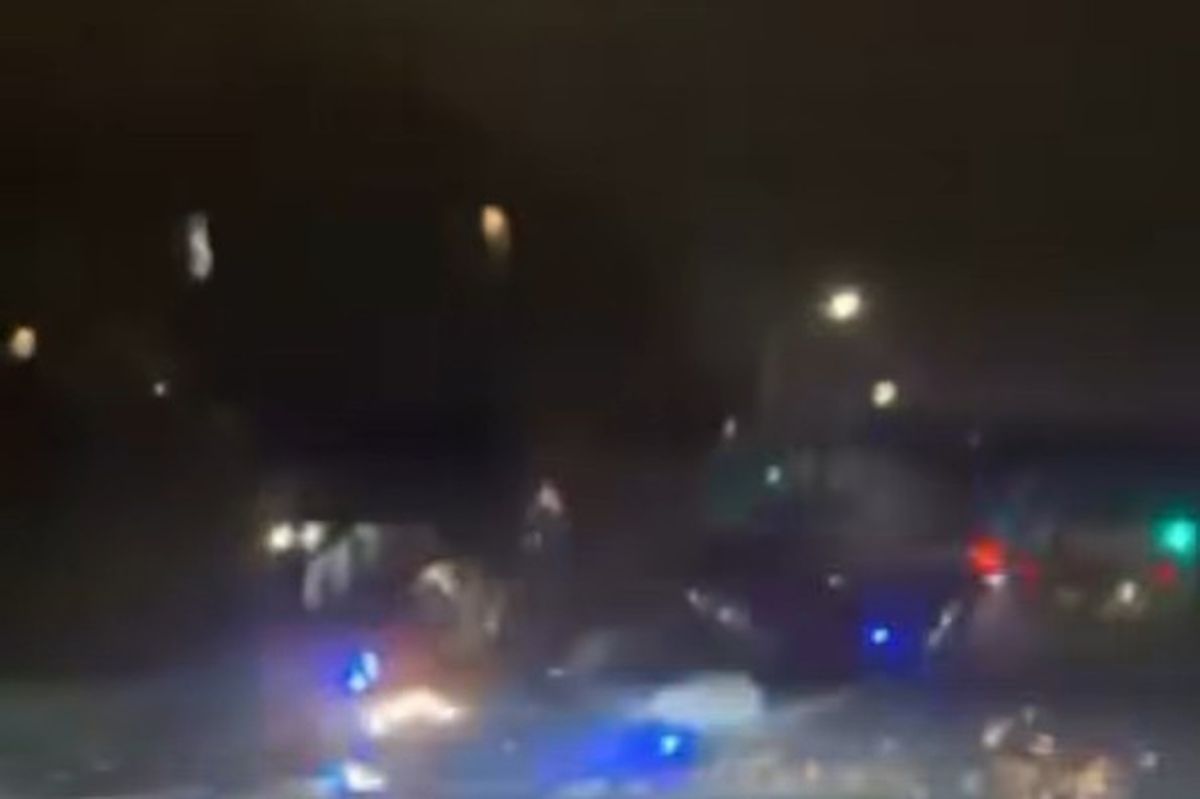 Sparks fly as the unmarked car rolls over in Stockport