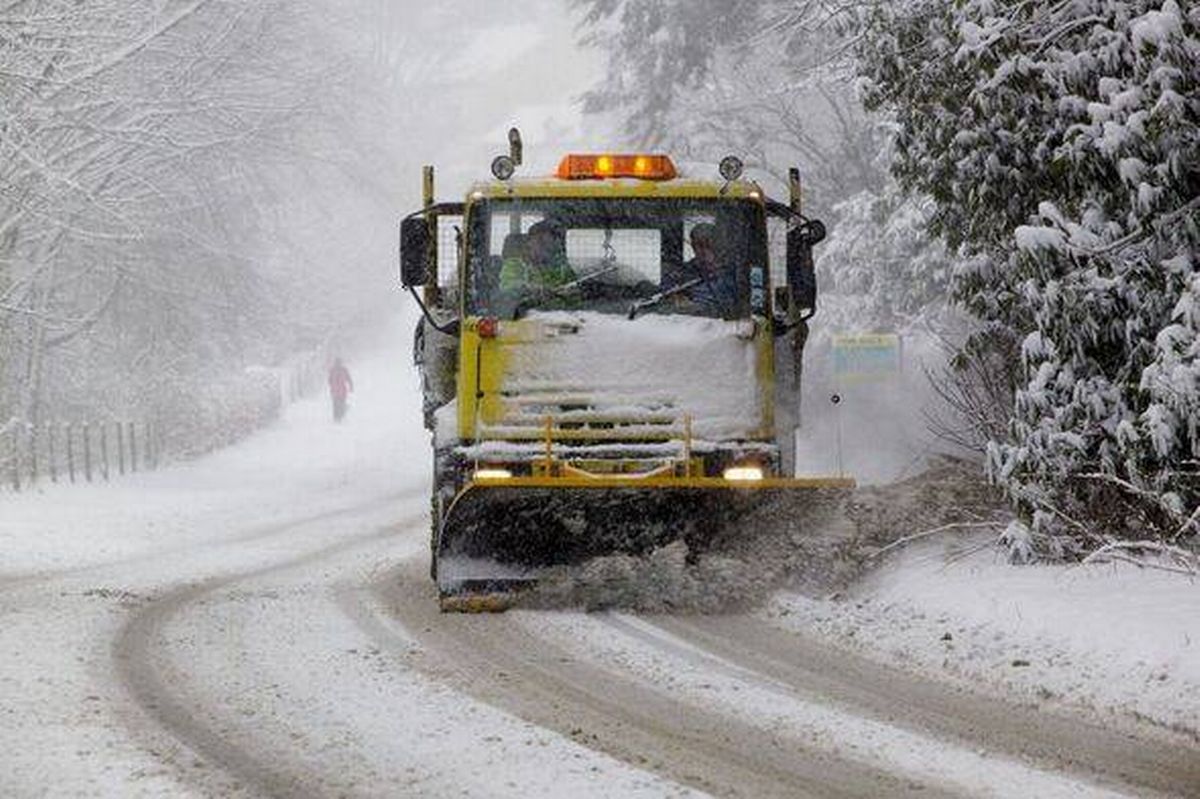 Snow Plow Clearing Road