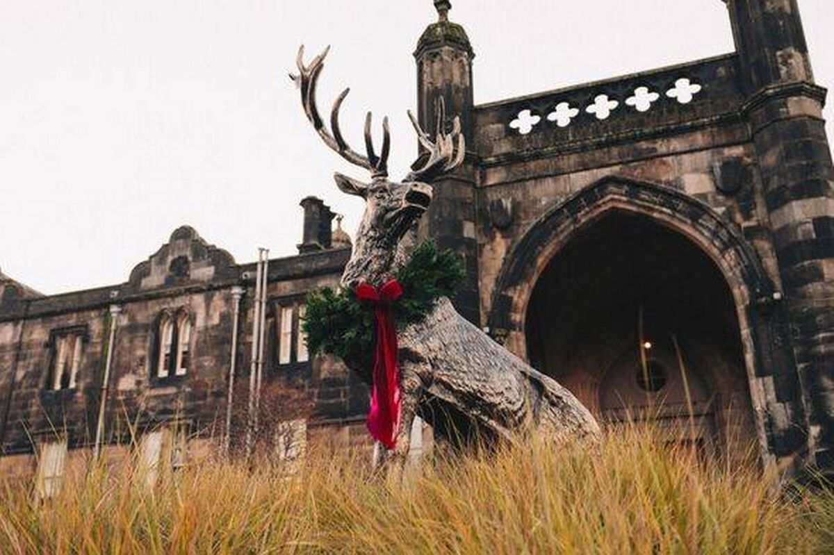 Stag statue outside Mar Hall with wreath and bow