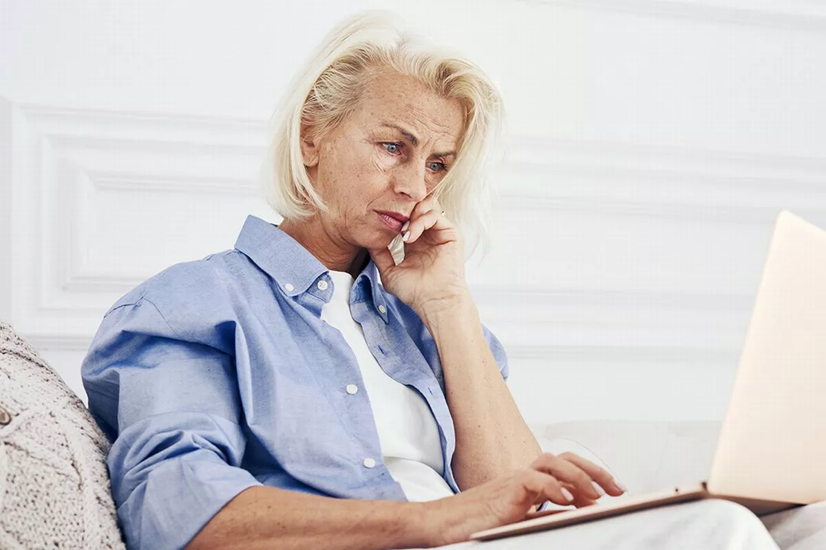 A woman checks her finances