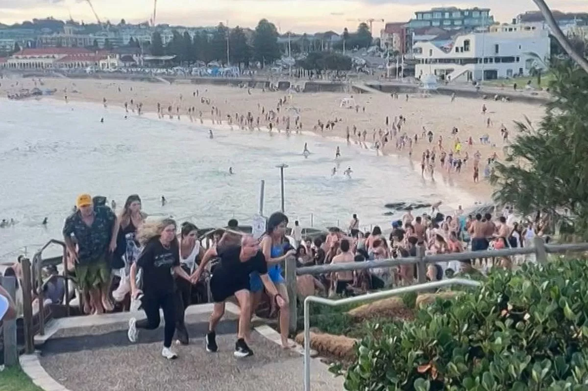 Beach-goers fleeing Bondi Beach after gunmen opened fire