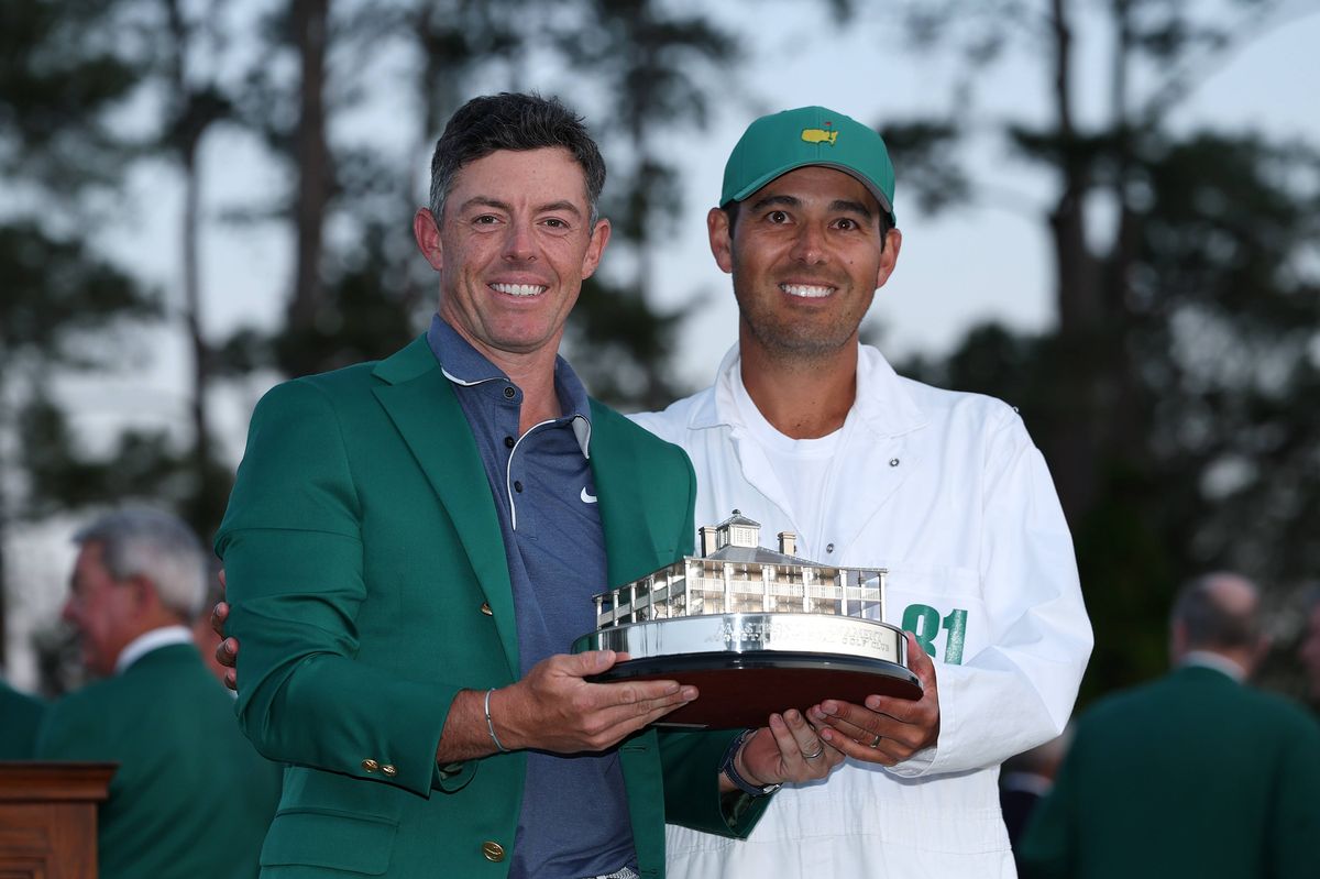 Rory McIlroy celebrates with caddie Harry Diamond after winning the 2025 Masters Tournament at Augusta National Golf Club