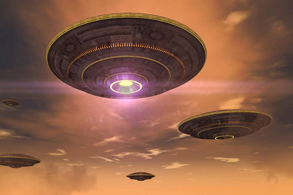 An image depicting a circular object, resembling a flying saucer, illuminated by a bright light from below, positioned against a backdrop of a cloudy sky.