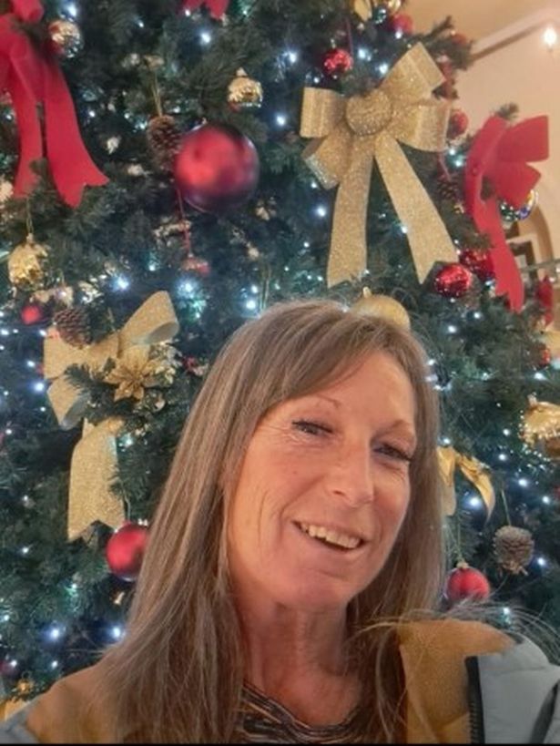 Vicki paints the windows of the RVI and also businesses in Dudley