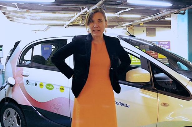 Zulma Guzman Castro in front of a car